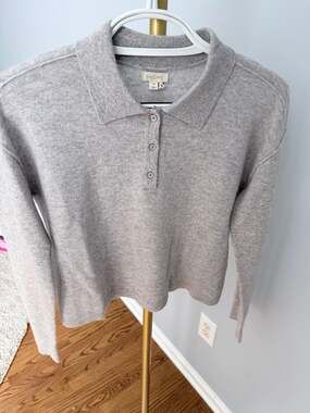 Pilcro 100% cashmere sweater in light grey. Long sleeves, button front with coll